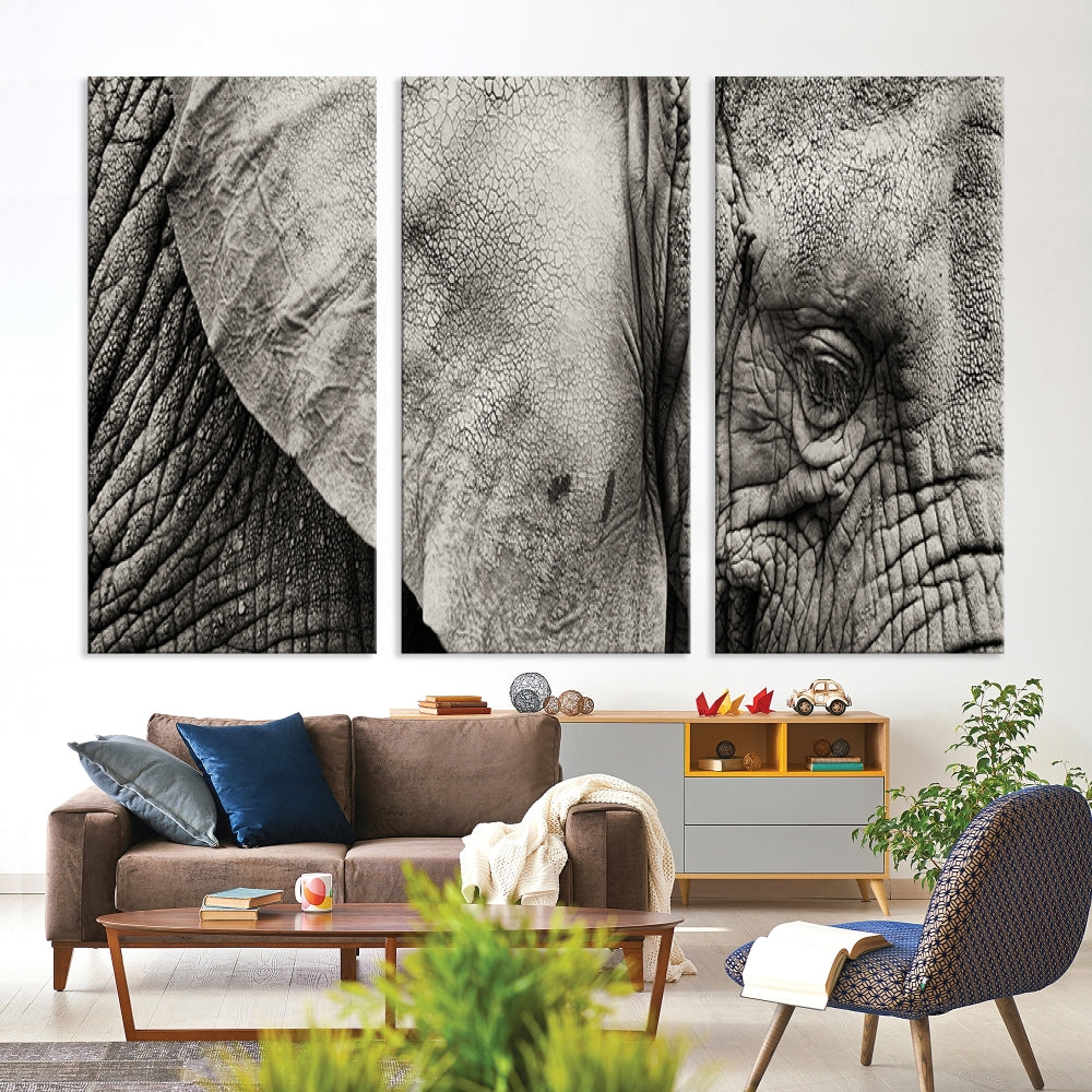 A modern living room features a large Elephant Wall Art Canvas Print in black and white, crafted on museum-quality canvases with UV-protective coating to maintain its elegance.