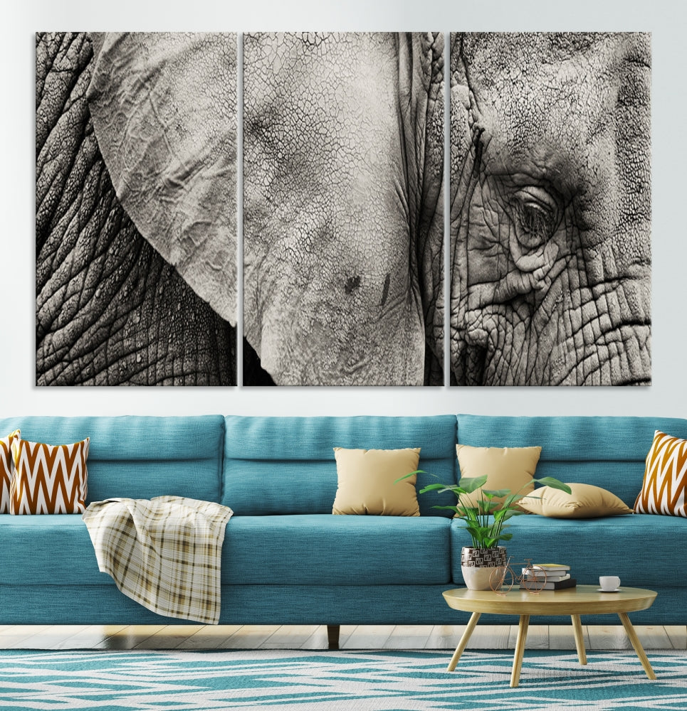 A modern living room features a large Elephant Wall Art Canvas Print in black and white, crafted on museum-quality canvases with UV-protective coating to maintain its elegance.