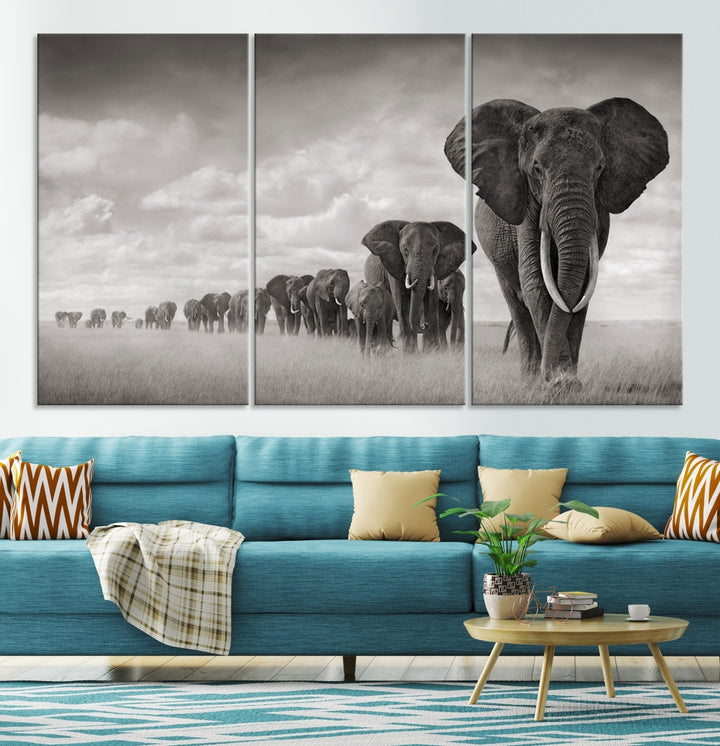 The Elephant Wall Art Canvas Print features a triptych of elephants in a savanna, elegantly displayed.