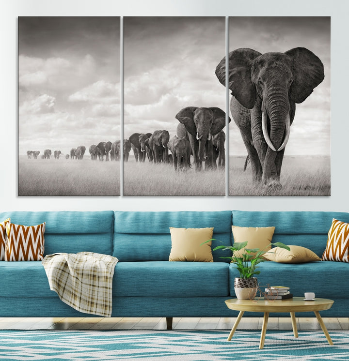 The "Herd of Elephants Wall Art Canvas Print" features an elegant black and white triptych of elephants walking in a line, beautifully displayed on museum-quality canvas with a UV-protective coating. This artwork arrives ready to hang and adds sophistication to any space.