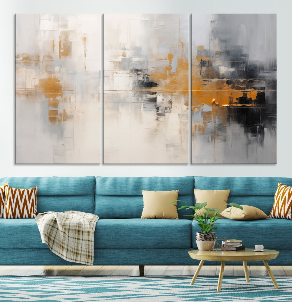 The Orange Pastel Abstract Wall Art Canvas Print, featuring a triptych of orange, white, and black hues, is elegantly displayed on museum-quality canvas.