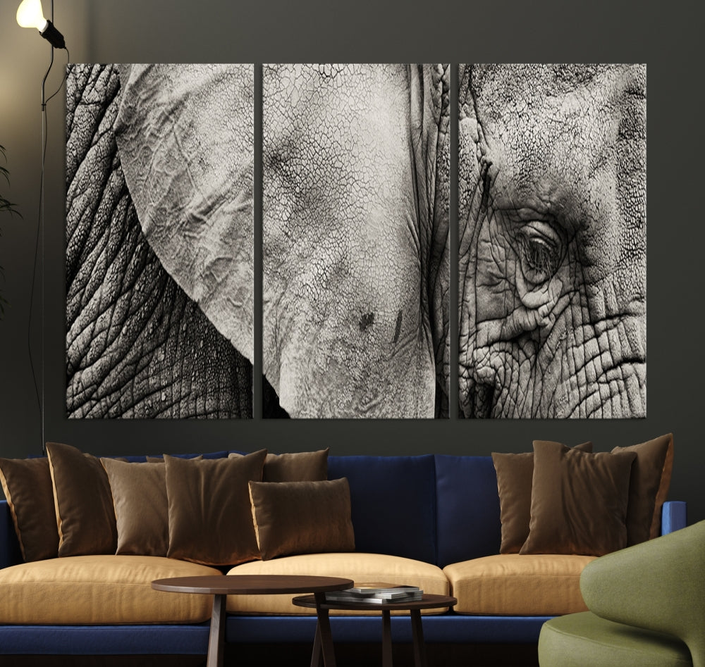 A modern living room features a large Elephant Wall Art Canvas Print in black and white, crafted on museum-quality canvases with UV-protective coating to maintain its elegance.