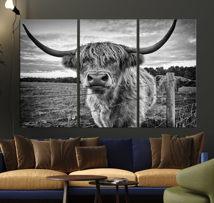 The "Scottish Highland Cow Canvas Wall Art Farmhouse Decor" adds a touch of rustic charm to your living room wall above the couch.