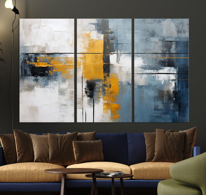 The Orange Abstract Wall Art Print features a series of white, blue, black, and yellow blocks arranged in a triptych format on museum-quality canvases. Proudly made in the USA and offered with free shipping.