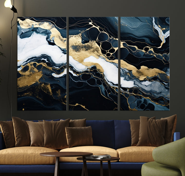 Fluid Marble Abstract Wall Art Print, a contemporary piece with black, white, and gold swirls on museum-quality canvas.