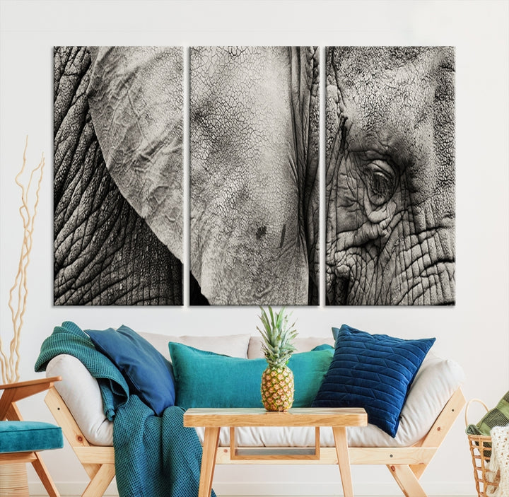 A modern living room features a large Elephant Wall Art Canvas Print in black and white, crafted on museum-quality canvases with UV-protective coating to maintain its elegance.