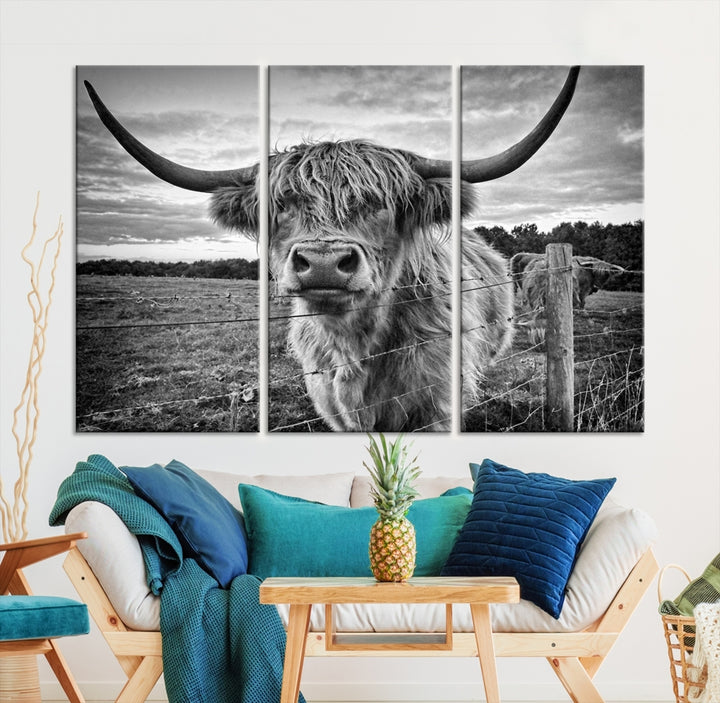 The "Scottish Highland Cow Canvas Wall Art Farmhouse Decor" adds a touch of rustic charm to your living room wall above the couch.