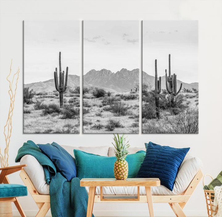 The modern living room showcases the "Black White Arizona Desert Canvas Wall Art Cactus Farmhouse Wall Art," a triptych consisting of gallery-wrapped, museum-quality black-and-white desert landscape photographs featuring cacti.