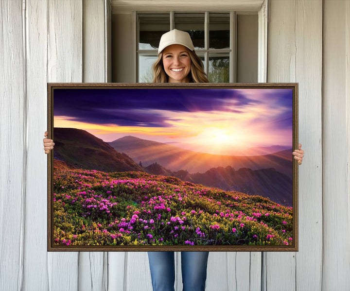 Gallery-wrapped wall art of a stunning mountain sunset and purple flowers.