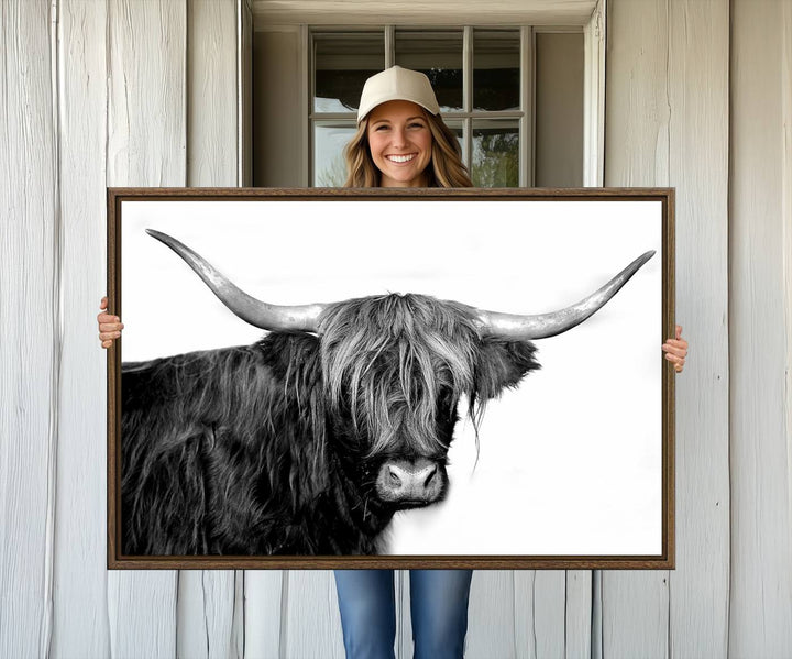 The Black and White Highland Cow Multi Panel Wall Art Canvas Print with UV-protection hangs prominently.