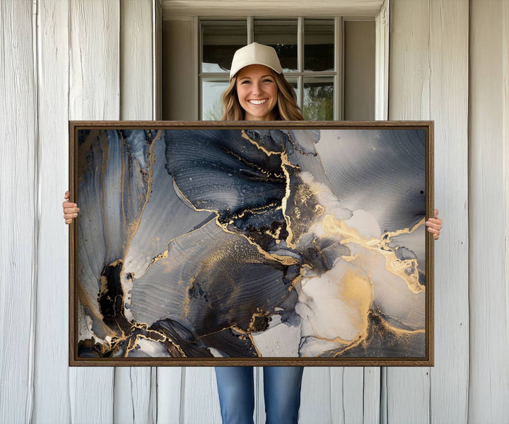 A Modern Marble Fluid Effect Abstract Wall Art with black, white, and gold swirls hangs in a modern kitchen.