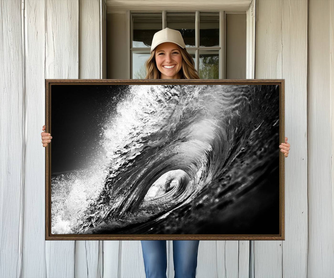 The Black Ocean Wave at Sunset Canvas Art hangs on a grey wooden wall.