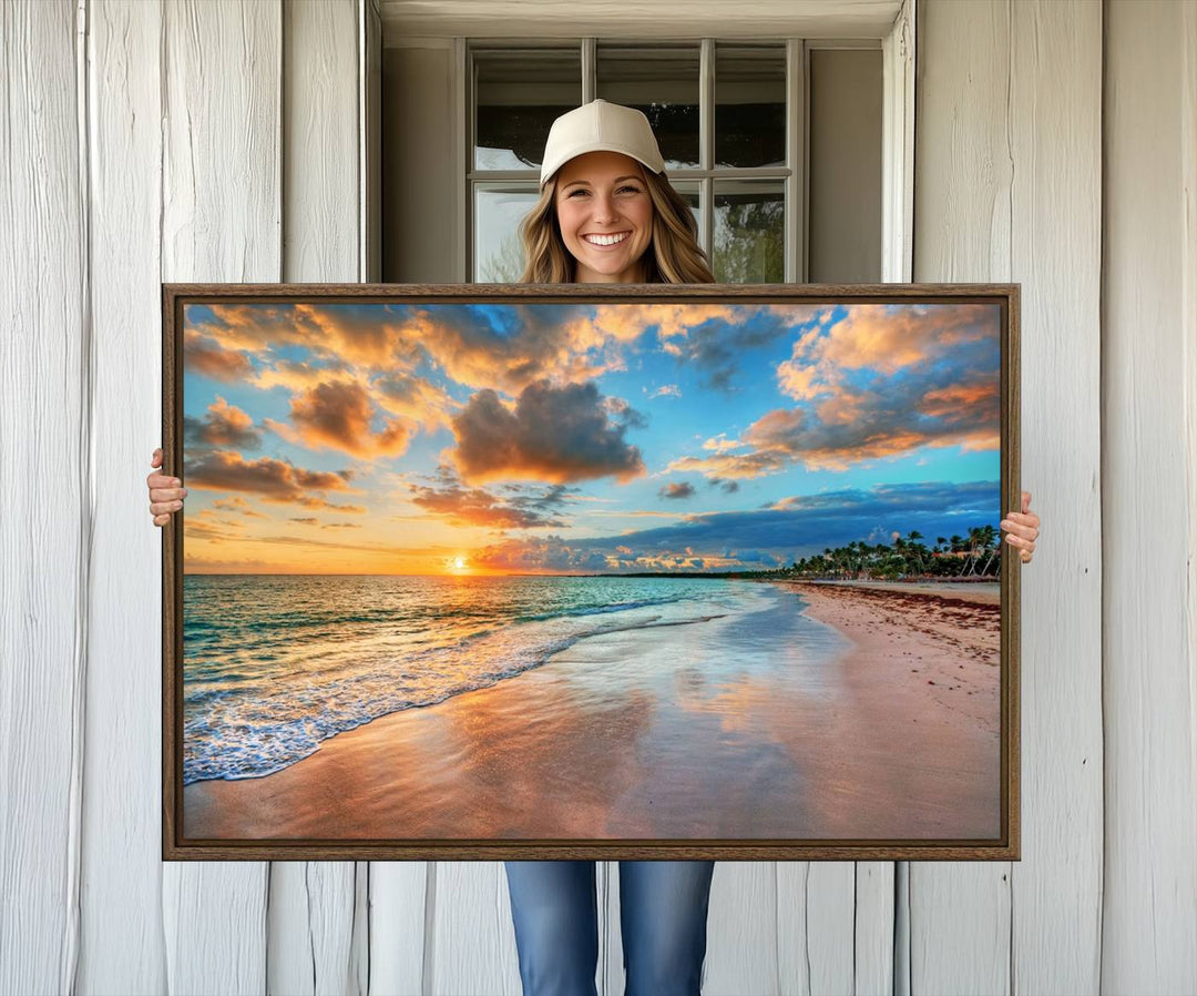 A wall displays Sunset Ocean Waves on Tropical Beach 3-panel canvas art.