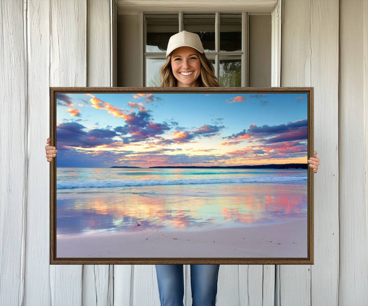 The Tranquil Pastel Sunset Beach Triptych Canvas Art hangs, showcasing its serene beauty.