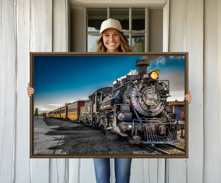 The Train Wall Art Canvas Print features a vintage steam train with a bright headlight.