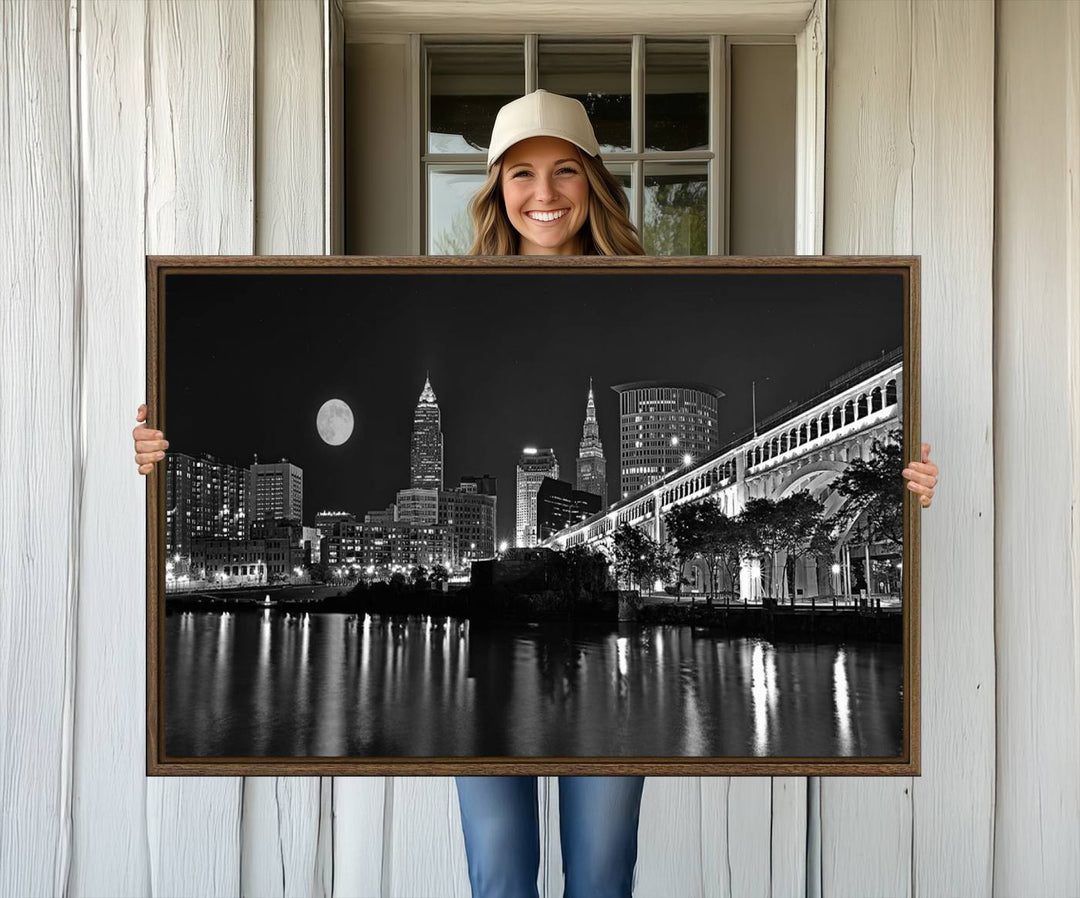 Cleveland Night Skyline Canvas Print: A museum-quality piece, ready to hang, featuring a stunning full moon and its reflections below.