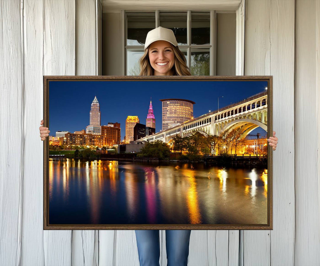 Cleveland Night Skyline Canvas: Cityscape with an illuminated bridge reflecting on calm water.