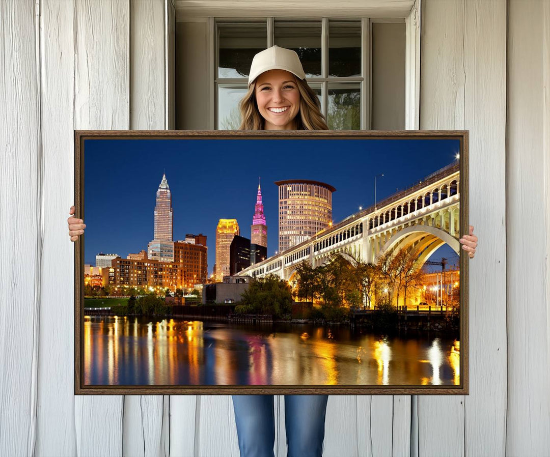 The Cleveland City Lights Canvas showcases a lit-up bridge and cityscape at night.