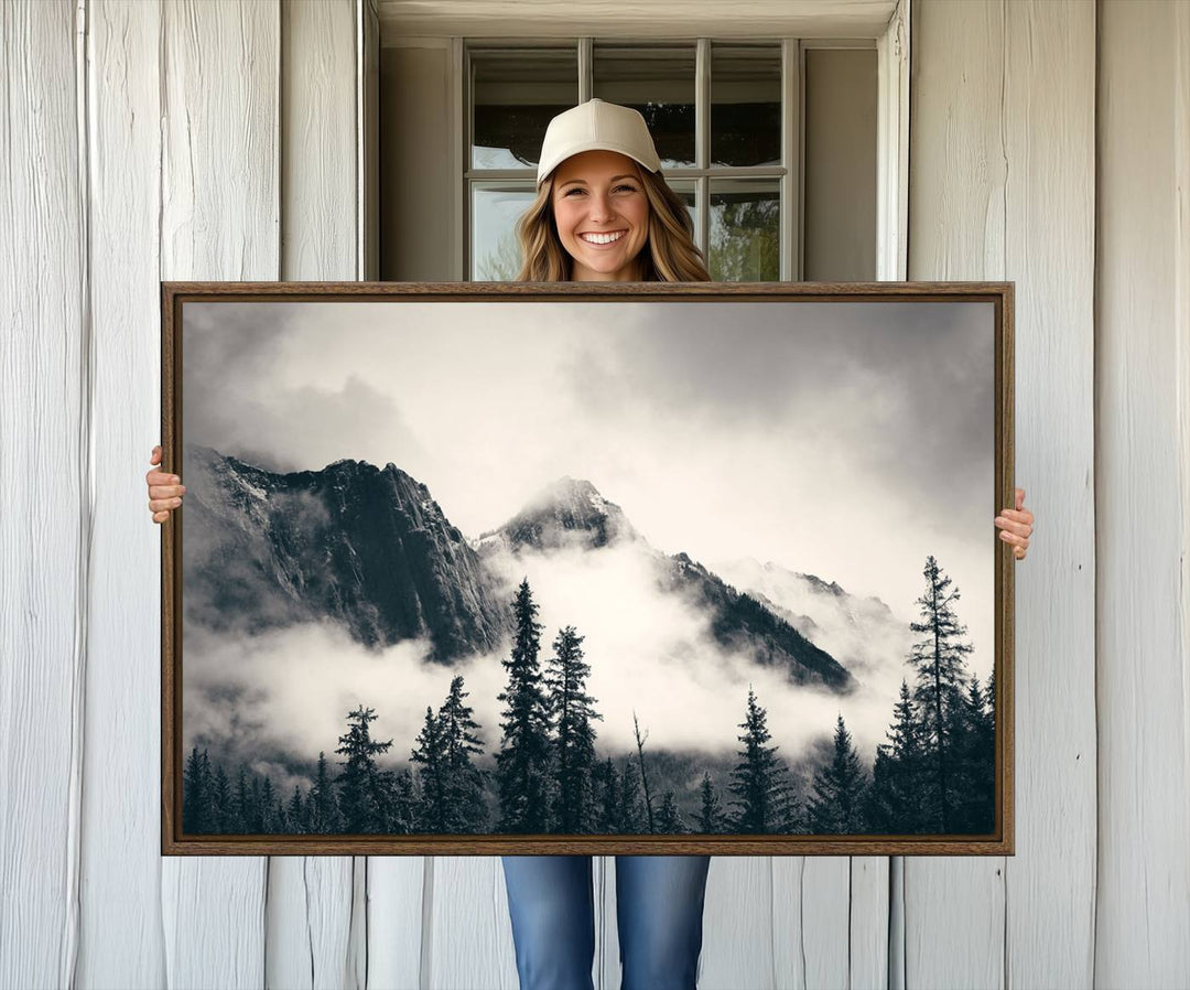 A large foggy mountain forest canvas print hangs prominently in the room.