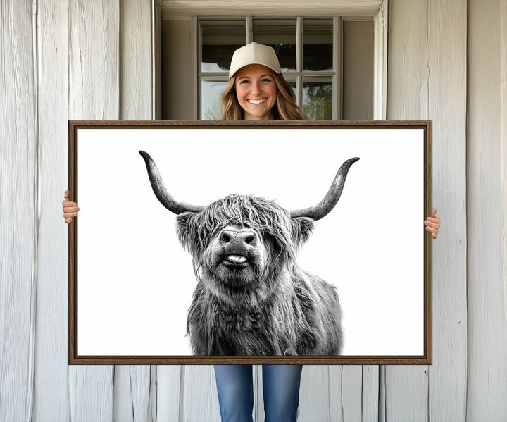 The Fanny Highland Cow art print decorates the modern kitchen, featured in black and white.