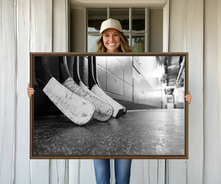 Ice Hockey Wall Art Canvas Print features a UV-protected black and white photo of hockey sticks.