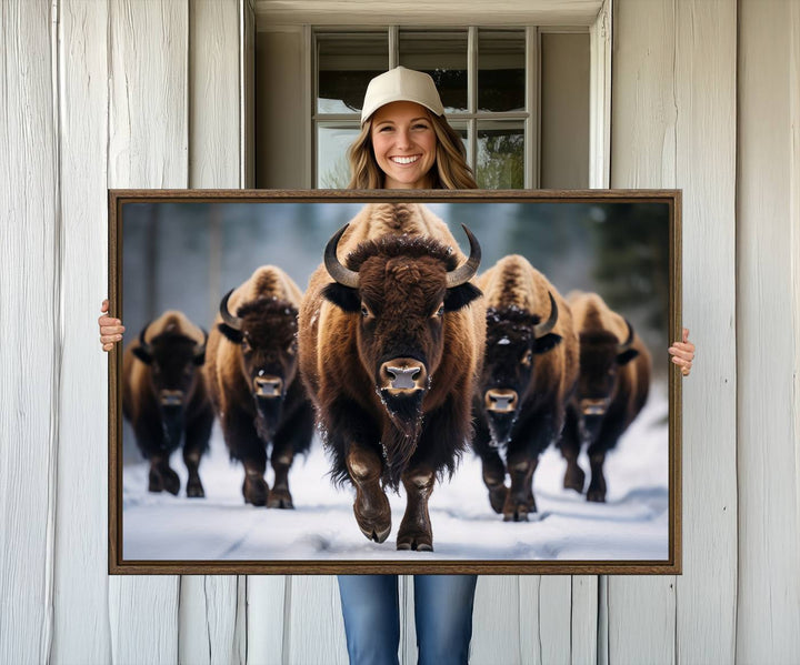 The dining room features an American Bison Herd Canvas Print against the snow.