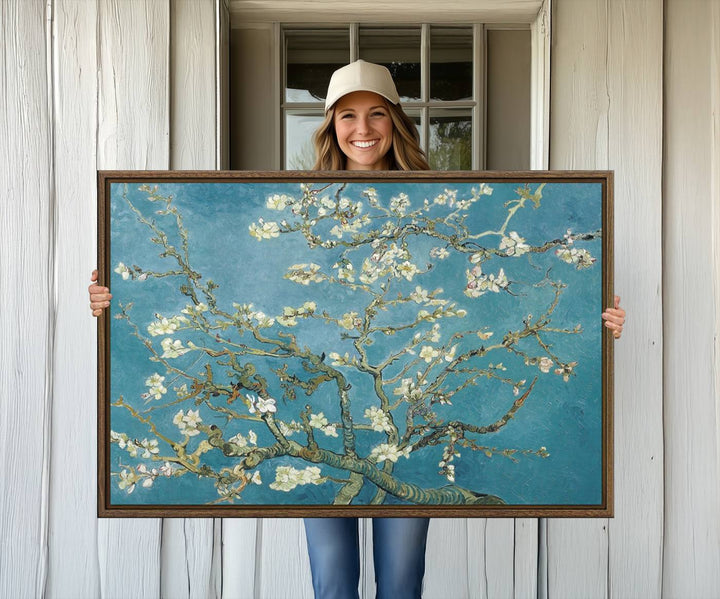 The wall art, Vincent Van Goghs Almond Blossom, stands out with its vibrant depiction against a serene blue background.