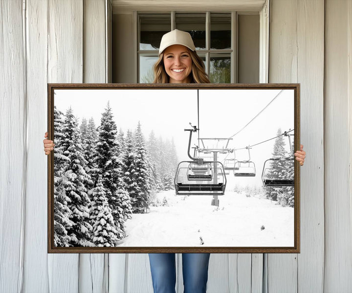 The Ski Wall Art, featuring the "Ski Lift Wall Art Canvas Print," presents a snowy scene with snow-covered spruce trees and is elegantly showcased on a dark green wall.