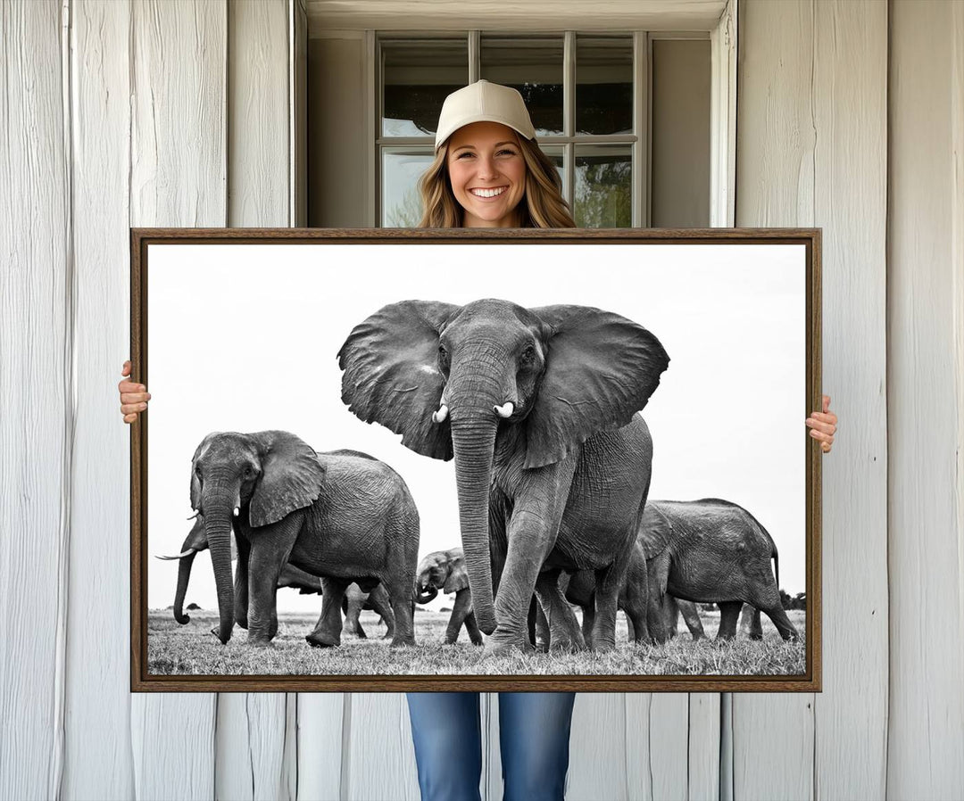 A modern dining area features a Black White Elephant Family Wall Art Canvas Print.