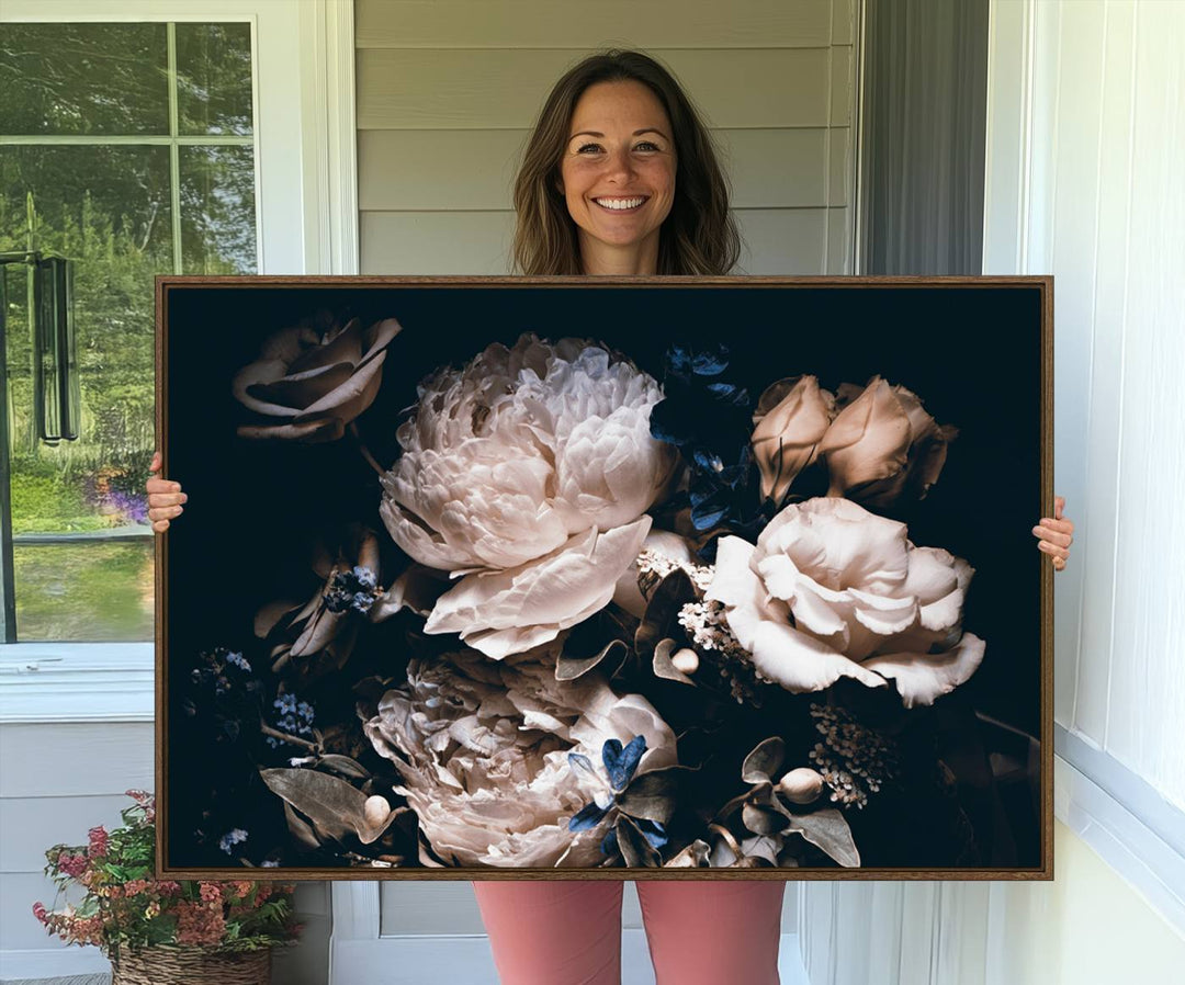 A large canvas art print of pink peonies flowers adds a vibrant touch to the space.