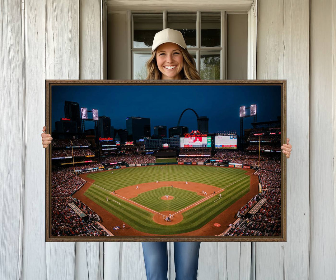 A St. Louis Cardinals Baseball Team print of Busch Stadium at night adorns the wall.