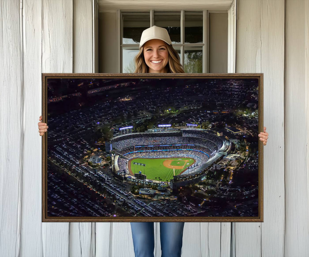 A large Los Angeles Dodgers print of Dodger Stadium at night is displayed near a window.