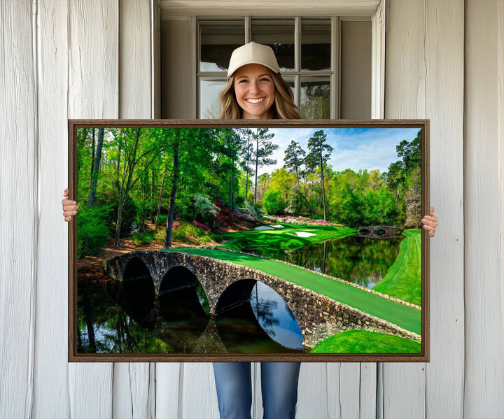 The wall art from Augusta National Golf Club showcases a panoramic bridge set against rich, lush greenery on a framed triptych canvas.