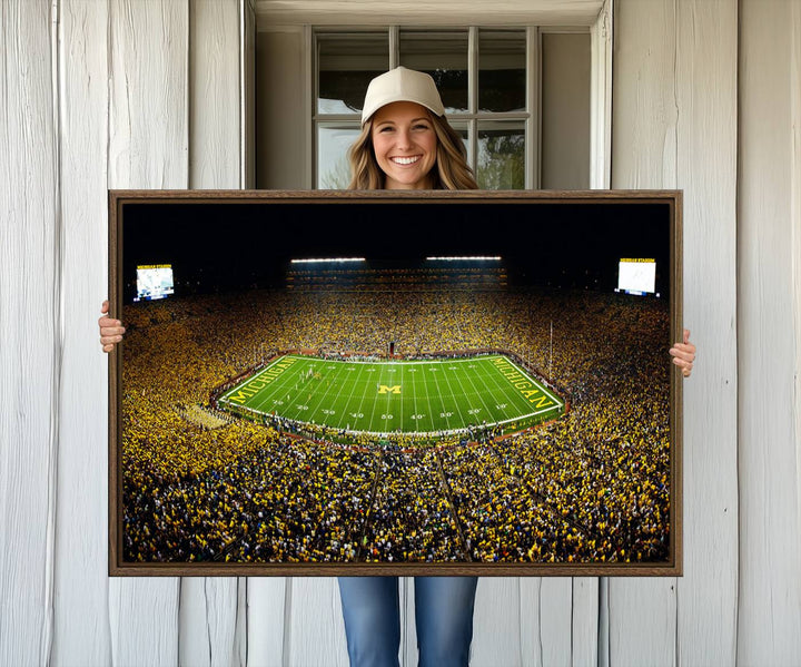 Aerial view of Michigan Stadium night game, ideal for Michigan Wolverines Football Team displayed on a triple canvas wall art.