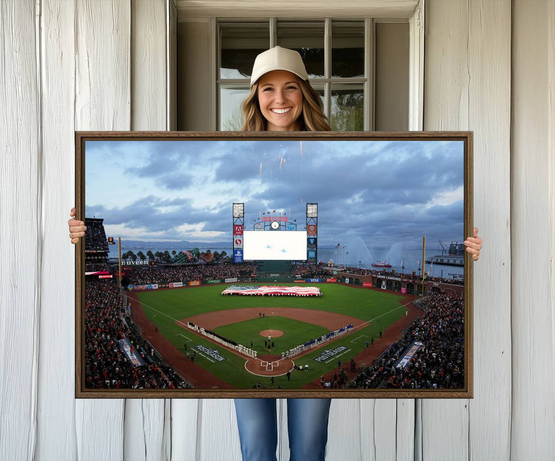 This framed 3-panel canvas MLB wall art features a giant flag and fans under a cloudy sky at Oracle Park.