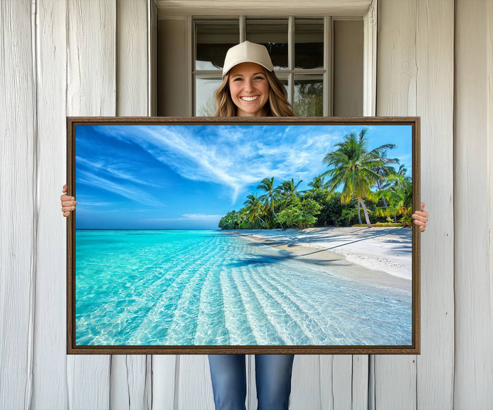 The Tropical Beach Wall Art Canvas Print showcases a serene ocean landscape with crystal clear turquoise water and palm trees, beautifully enhancing the coastal decor.