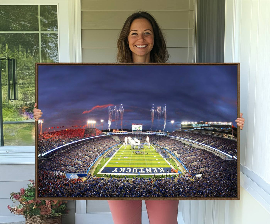 A filled stadium at dusk and fireworks overhead are beautifully captured in the Kroger Field Canvas Wall Art - Sunset Football Stadium Decor.