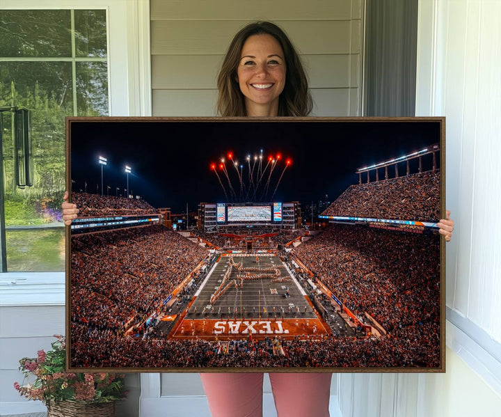 A Texas Memorial Stadium canvas print with fireworks embellishes the modern living room.