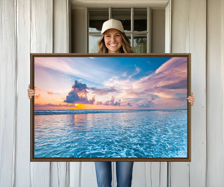 An Ocean Sunset Canvas Wall Art depicting a vibrant sky and rolling waves.