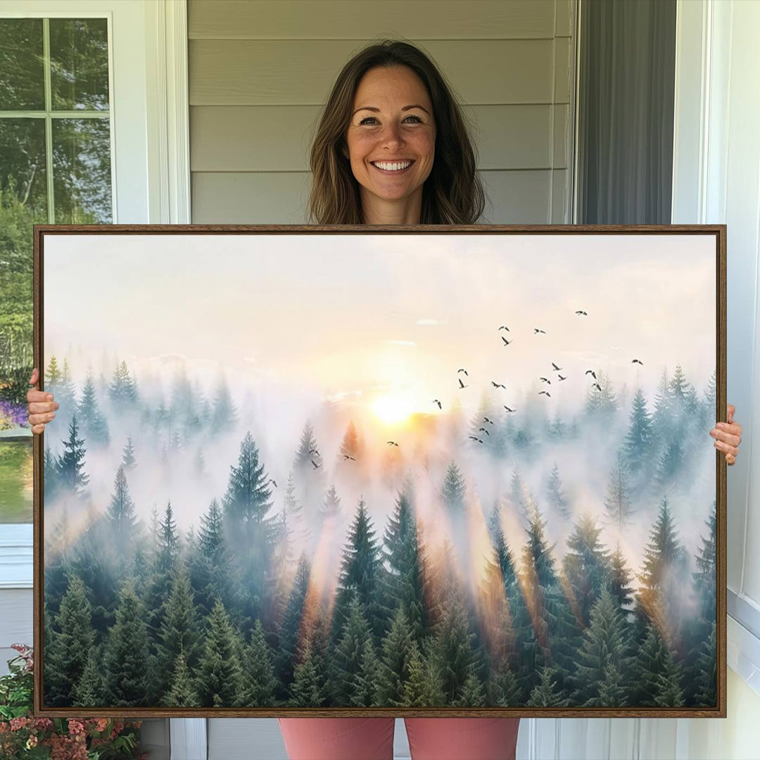 Misty Pine Forest Wall Art: A depiction of sunrise over foggy trees and birds against a bright sky; a framed woodland scene ideal for home or office decor.