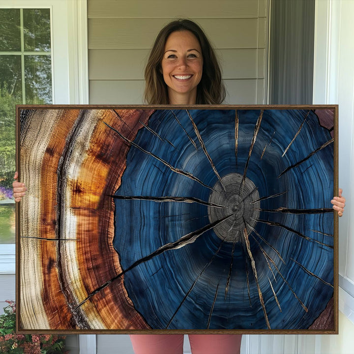 The Abstract Tree Rings Canvas Print features blue, brown, and orange rings that highlight wood grain and natures beauty.