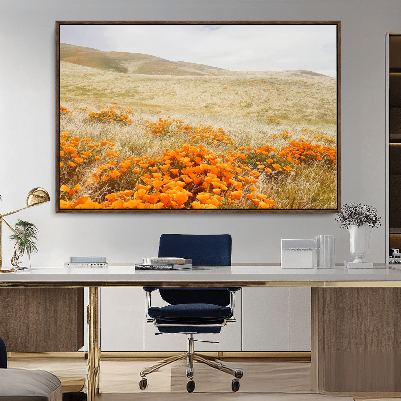 A golden field with vibrant orange poppies blooming across rolling hills under a soft, sunlit sky, creating a warm and rustic landscape.