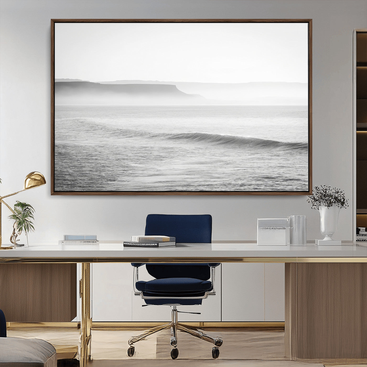 A black and white minimalist seascape featuring soft rolling waves and misty distant cliffs, creating a serene and timeless coastal atmosphere.