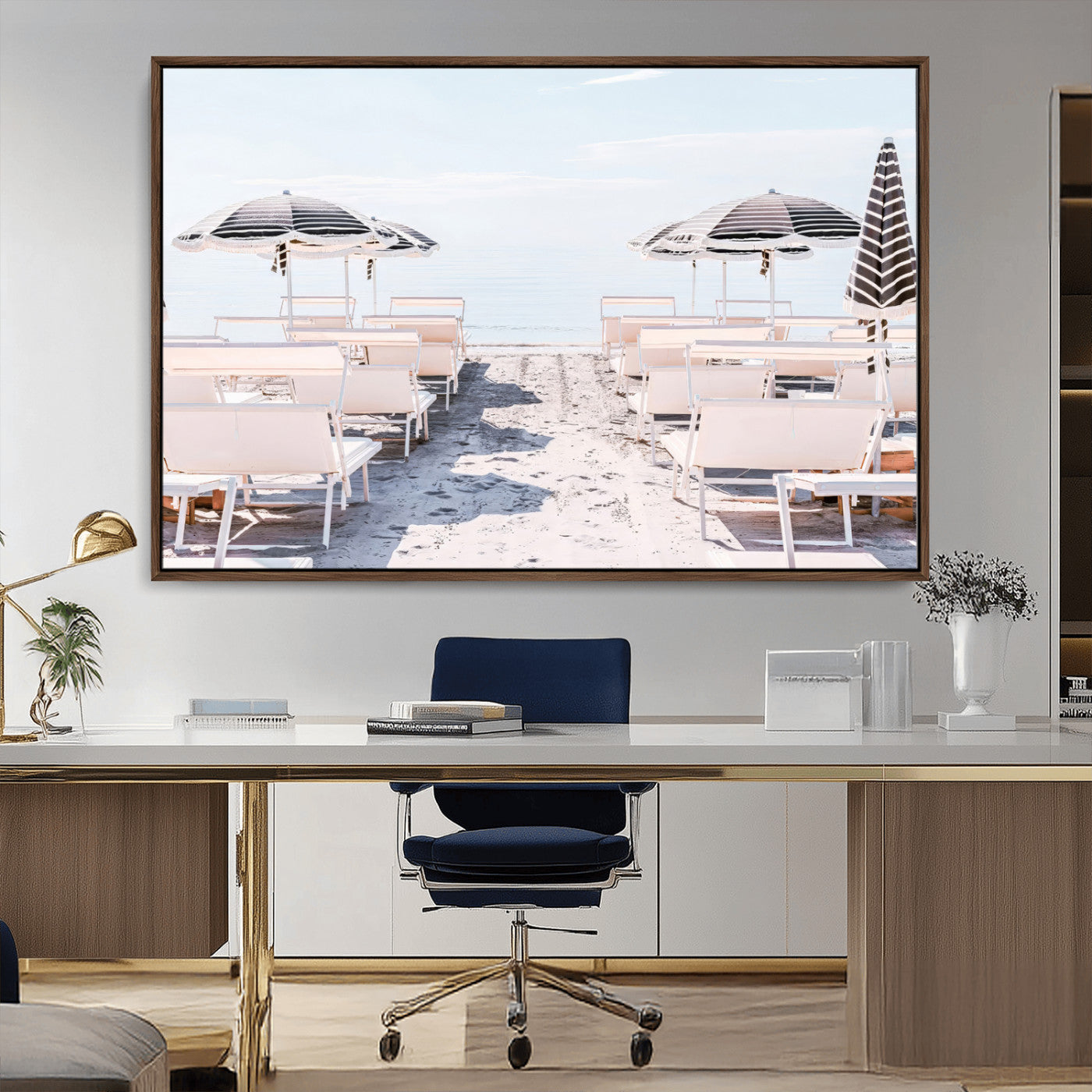 A serene minimalist beach scene featuring striped umbrellas, soft pastel sand, and an elegant lounge setup, creating a tranquil and stylish coastal retreat.