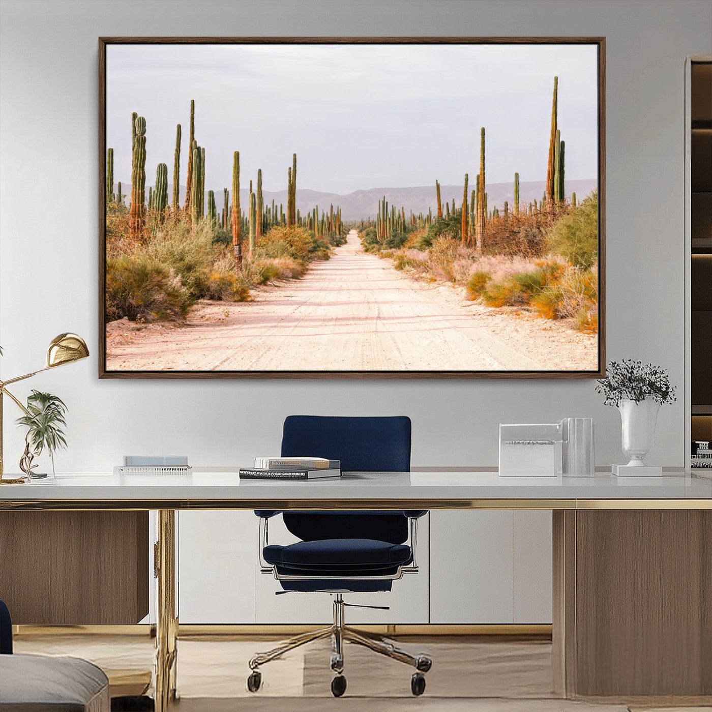 A desert road lined with saguaro cacti under a golden sky, creating a warm southwestern feel, perfect for boho or rustic decor.