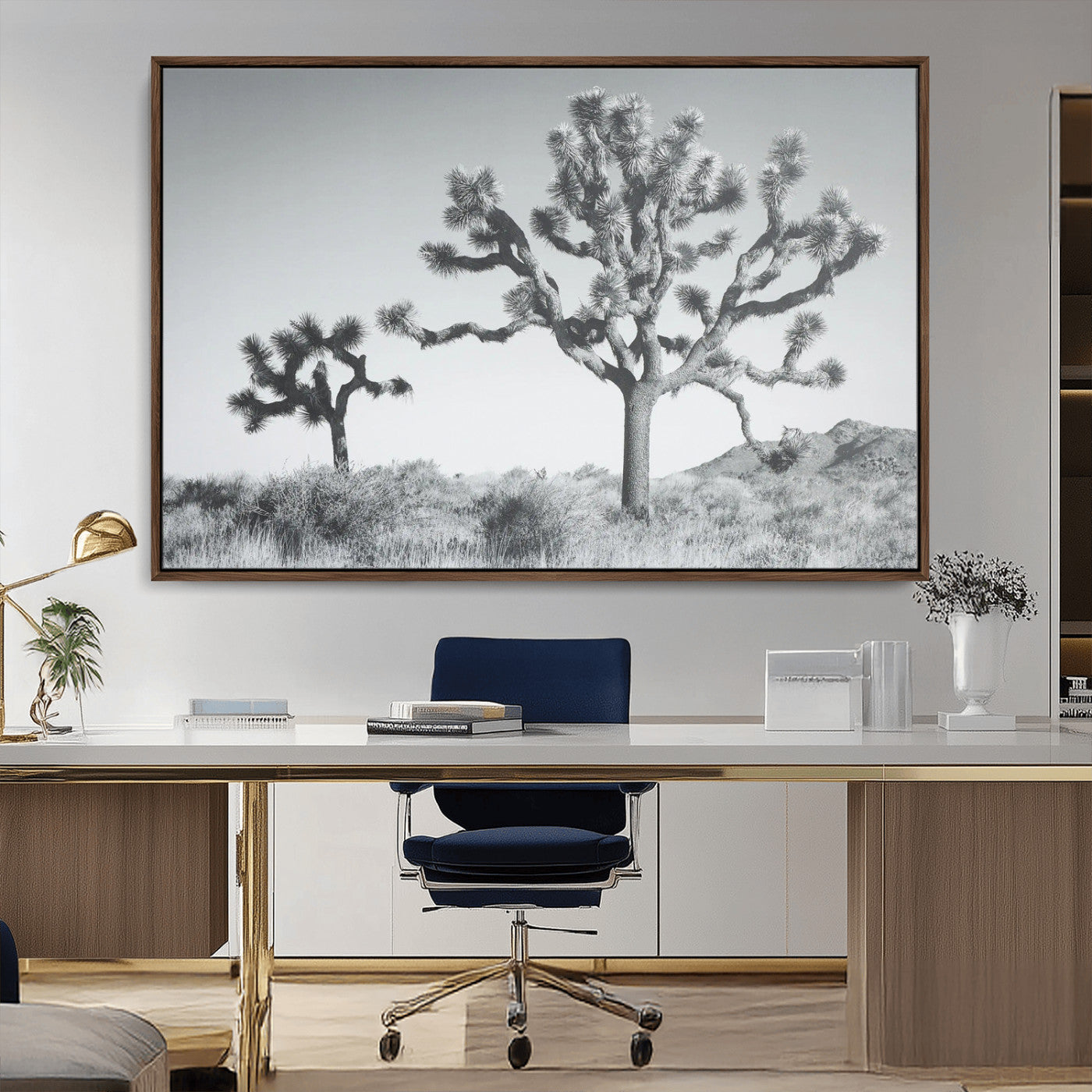 Two Joshua trees in a black and white desert landscape with distant hills, ideal for boho or rustic interior wall styling.