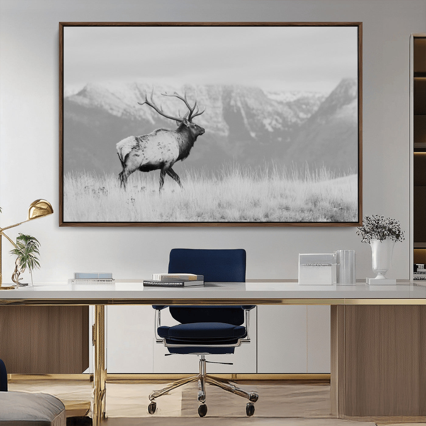Black and white elk standing in front of snowy mountain range, perfect for rustic lodge or nature-inspired wall decor.