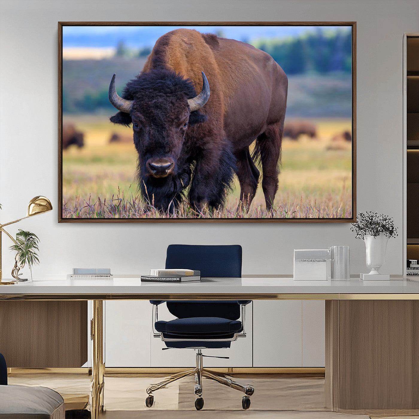Close-up of a strong American bison standing in a grassy prairie with a blurred herd in background, perfect for rustic lodge decor.