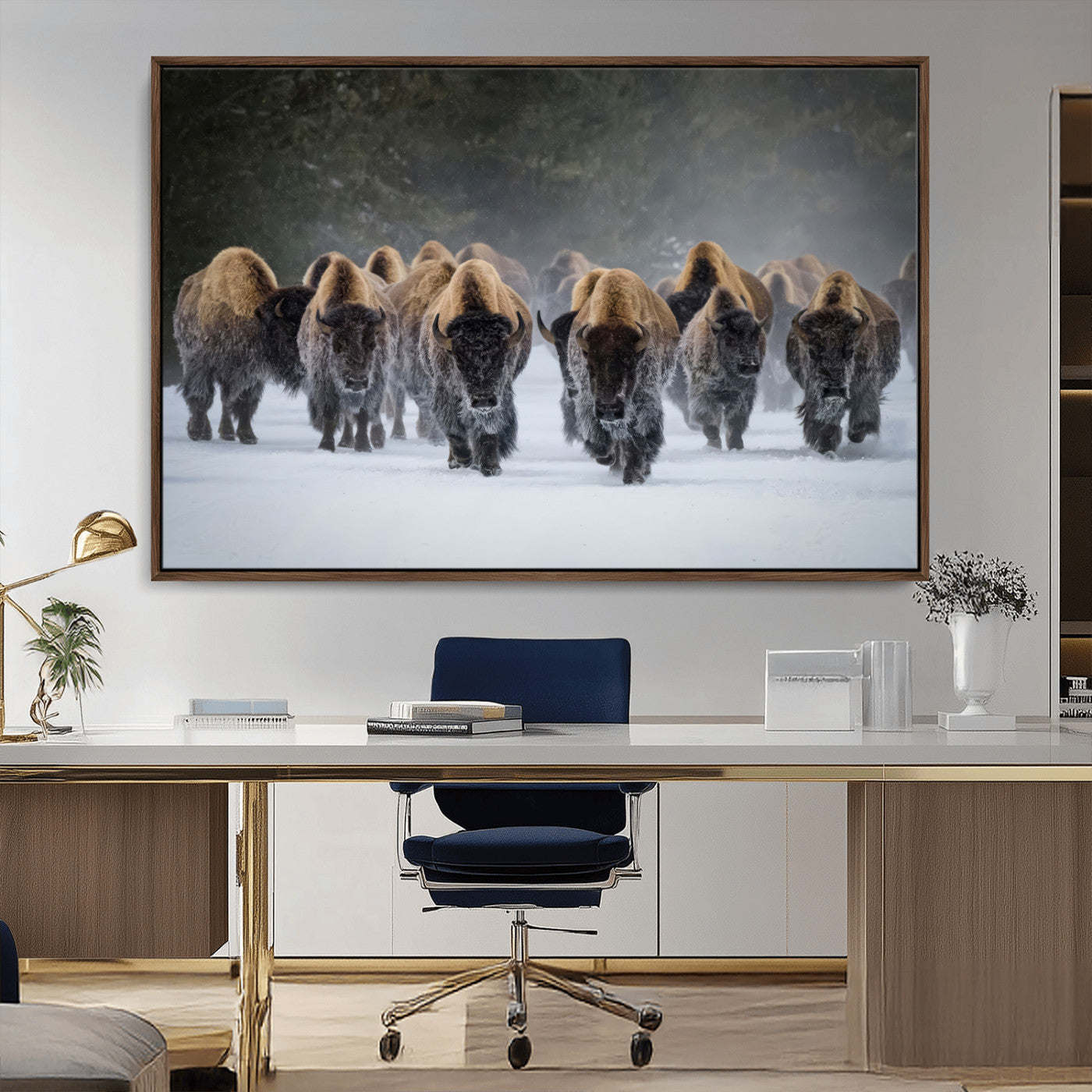 A herd of American bisons walking through deep snow in a forest, evoking a powerful rustic wilderness mood for western-style interiors.