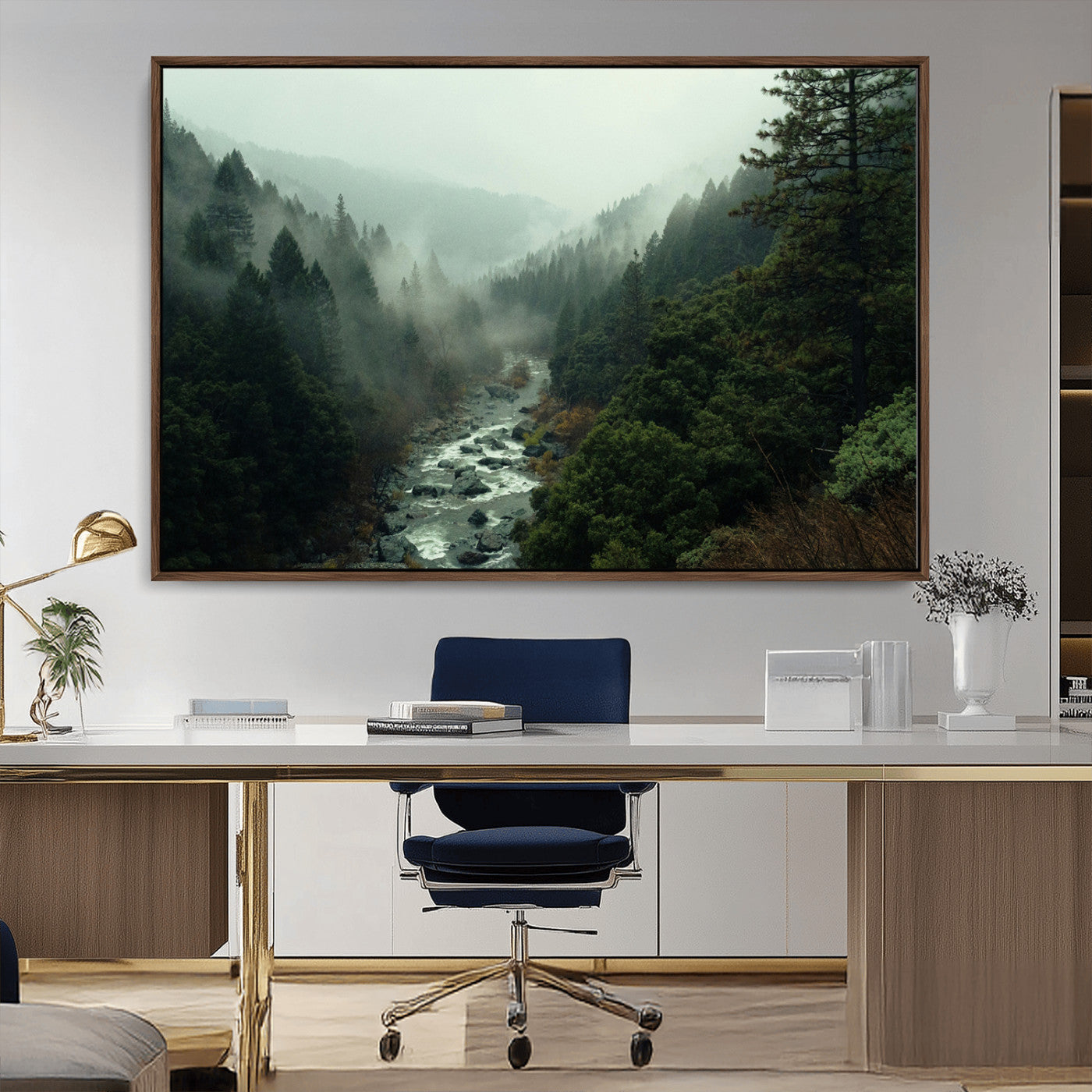 Misty forest with a winding river flowing through lush green mountains, creating a tranquil and moody wilderness landscape.